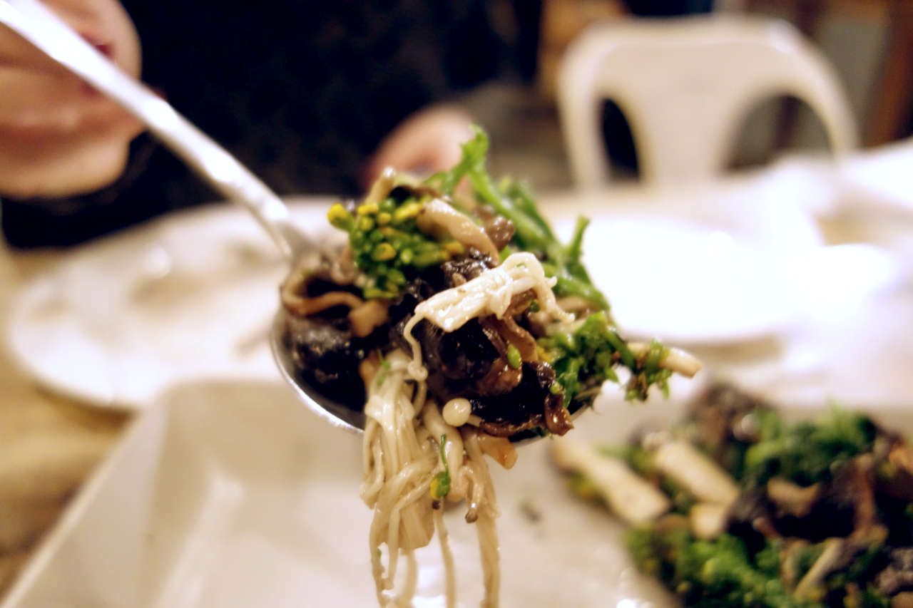 A spoonful of rapini and mushroom salad