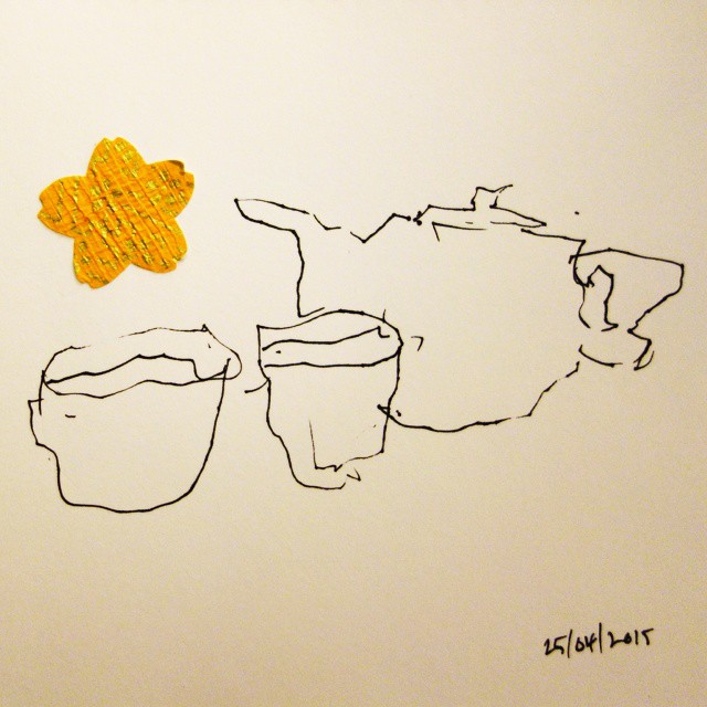 20: Black ink on white paper with washi paper flower, jagged line drawing of two teacups and a teapot