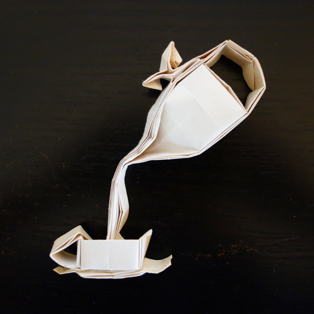 3: Origami folding of a teapot pouring liquid into a teacup