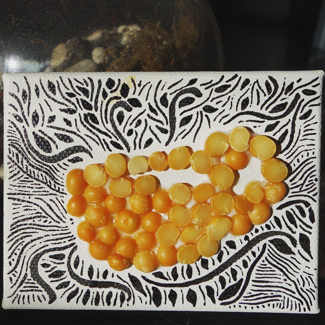 38: Two-dimensional teacup made with dried split peas glued to canvas, surrounded by organic hand-drawn patterns
