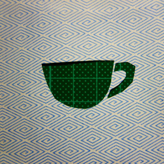 61: The patterned interior of an envelope with a teacup cut out