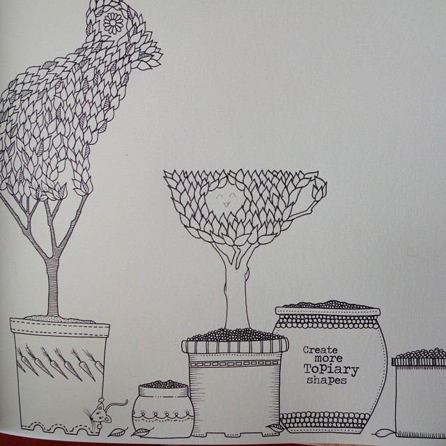 73: A smiling teacup topiary drawn on a colouring book page