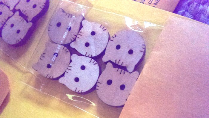 cat head buttons in a packet