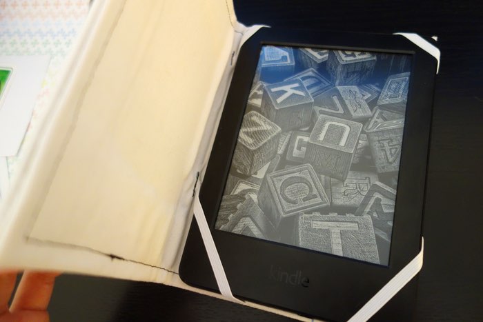 Kindle reader inside a home-made hardcover case