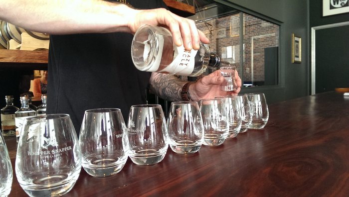 whiskey being poured at Whipper Snapper Distillery