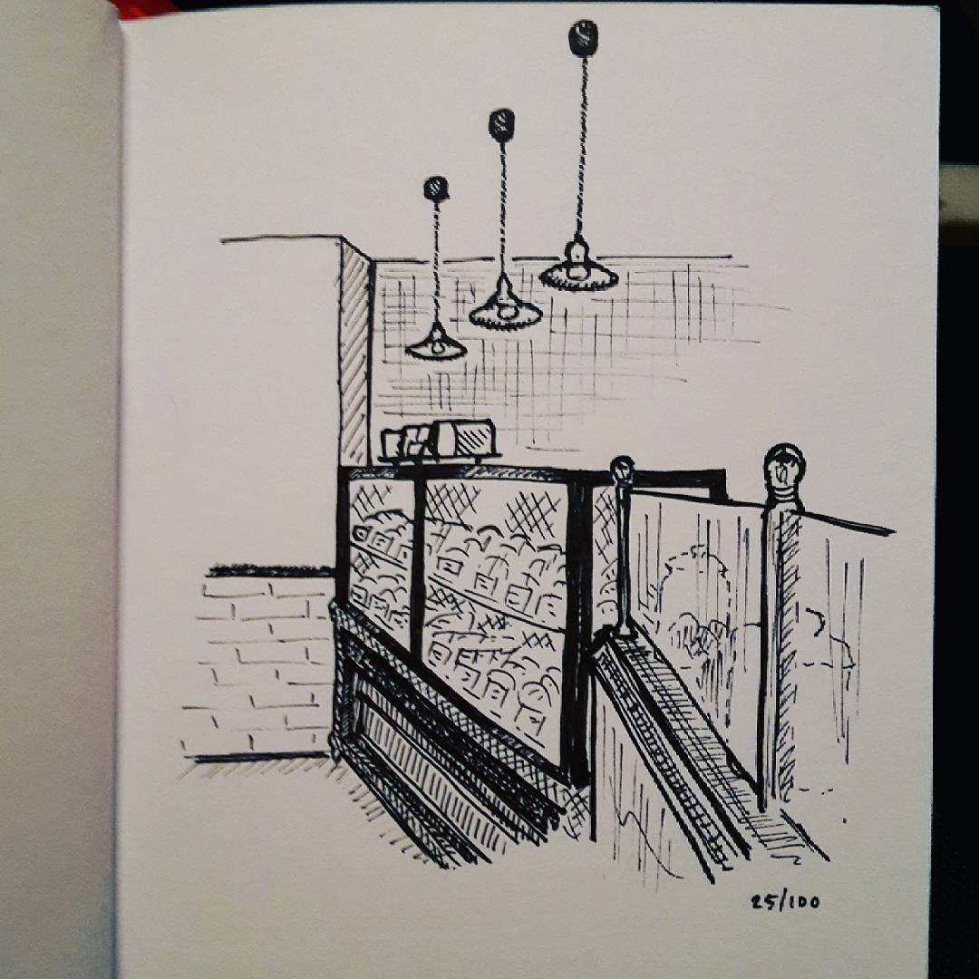 Ink sketch of the inside of a café, c. 2017.
