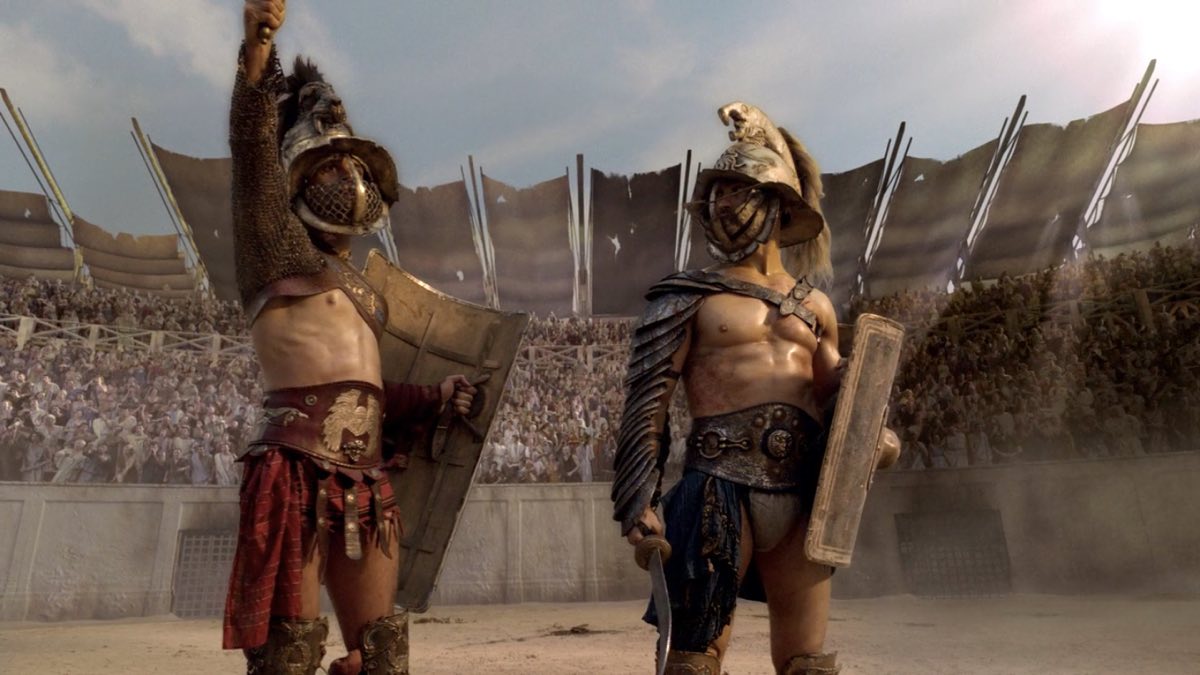 Crixus and Spartacus fight in murmillo armour. © STARZ